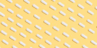 Top 12 Key Nutrients for Life Extension white capsules on yellow background