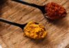 How Can Turmeric Heal The Damaged Brain? ground turmeric and hot paprika on cutting board