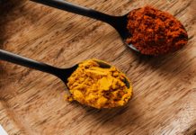 How Can Turmeric Heal The Damaged Brain? ground turmeric and hot paprika on cutting board