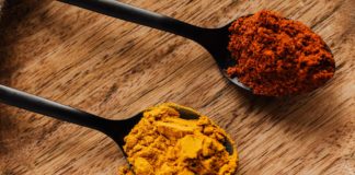 How Can Turmeric Heal The Damaged Brain? ground turmeric and hot paprika on cutting board