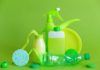 7 Non-Toxic Natural Cleaning Products reusable containers and crumpled bottle with kitchen utensils