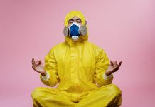 New Evidences Proves Long-Term Immunity Following COVID-19 Infection man in yellow protective suit