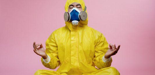 New Evidences Proves Long-Term Immunity Following COVID-19 Infection man in yellow protective suit