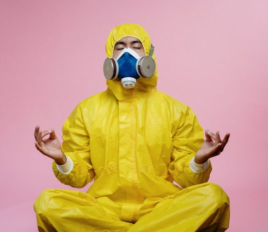 New Evidences Proves Long-Term Immunity Following COVID-19 Infection man in yellow protective suit
