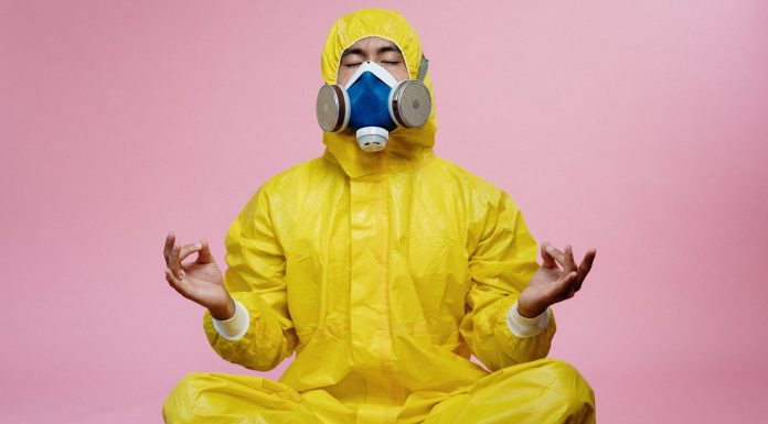 New Evidences Proves Long-Term Immunity Following COVID-19 Infection man in yellow protective suit